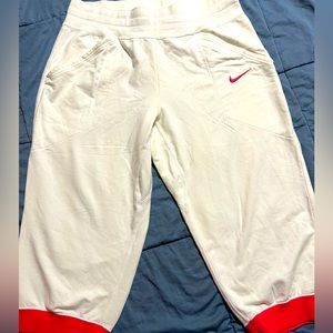 Nike Women’s Dri-fit White with Hot Pink Capri’s.